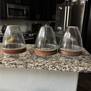 Set of three pendant light shades.